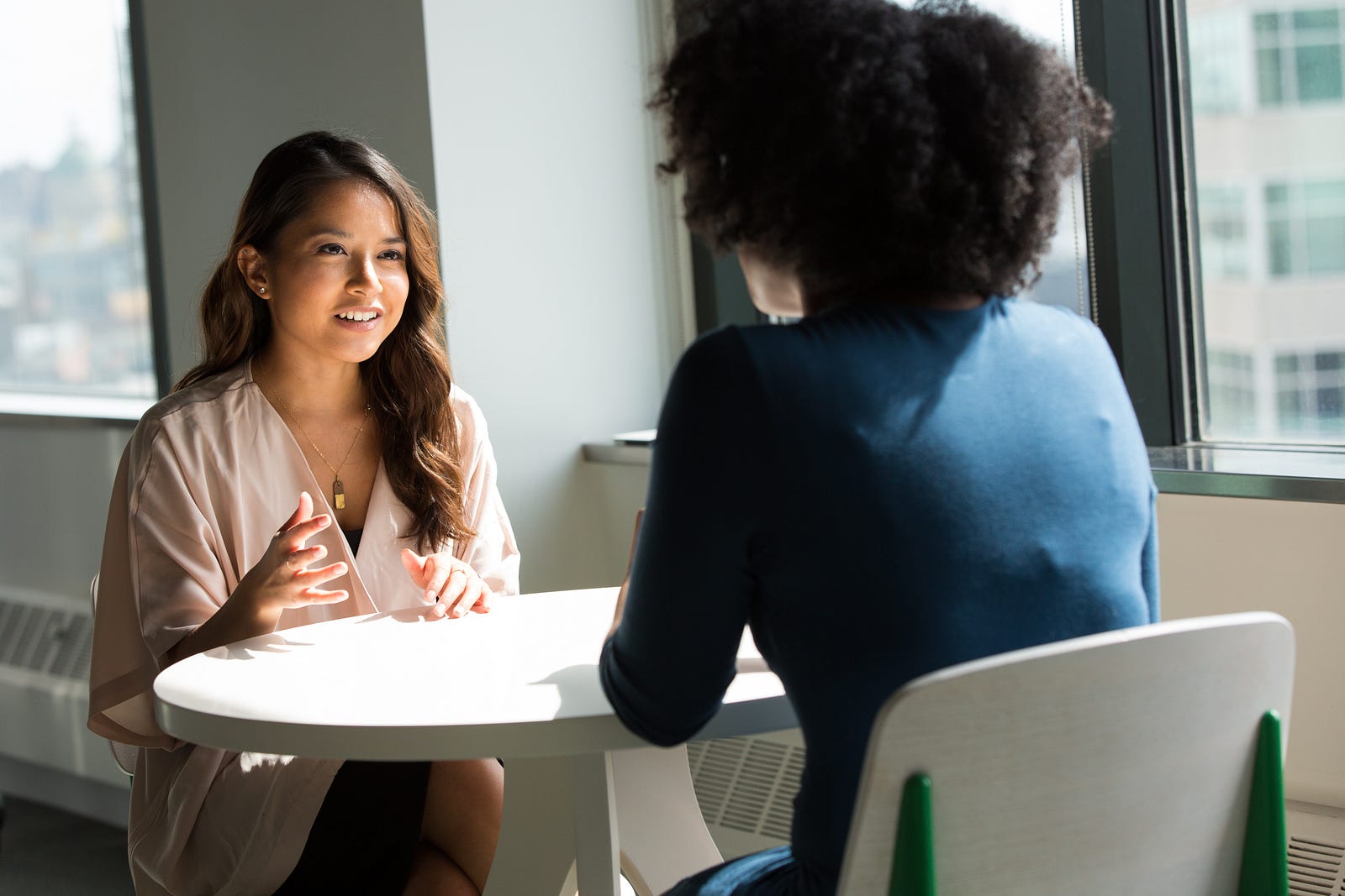 Two women talking in an office