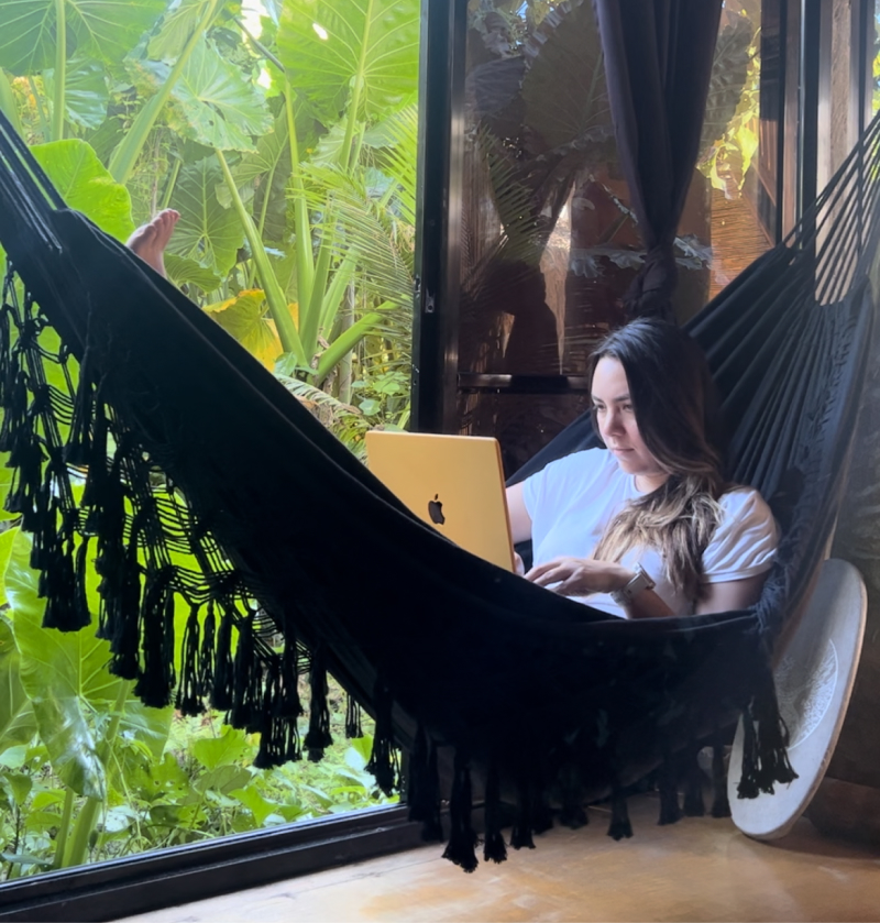 Elisabeth in a hammock while doing some work